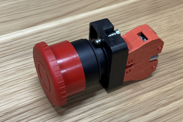 Emergency Sop Button black and red on bench top