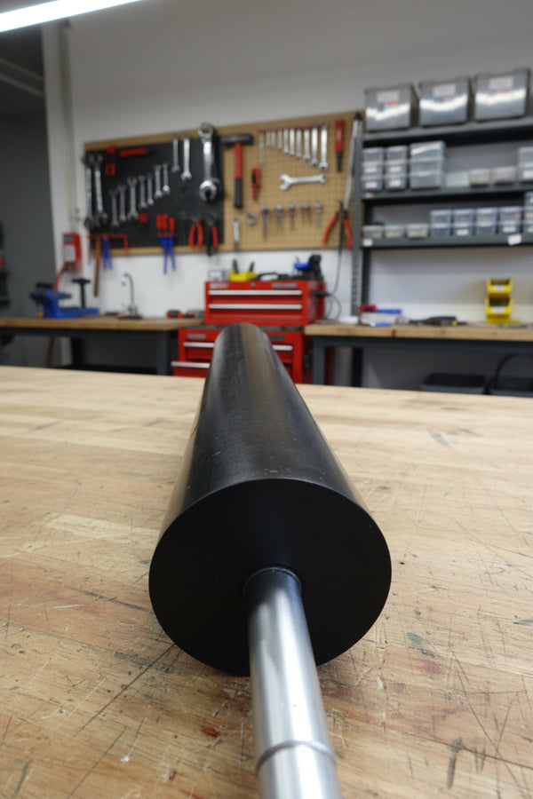 extractomat, mat washer, large black roller, slightly spongy to touch, Used to aid in removal of liquids from automotive floor mats
